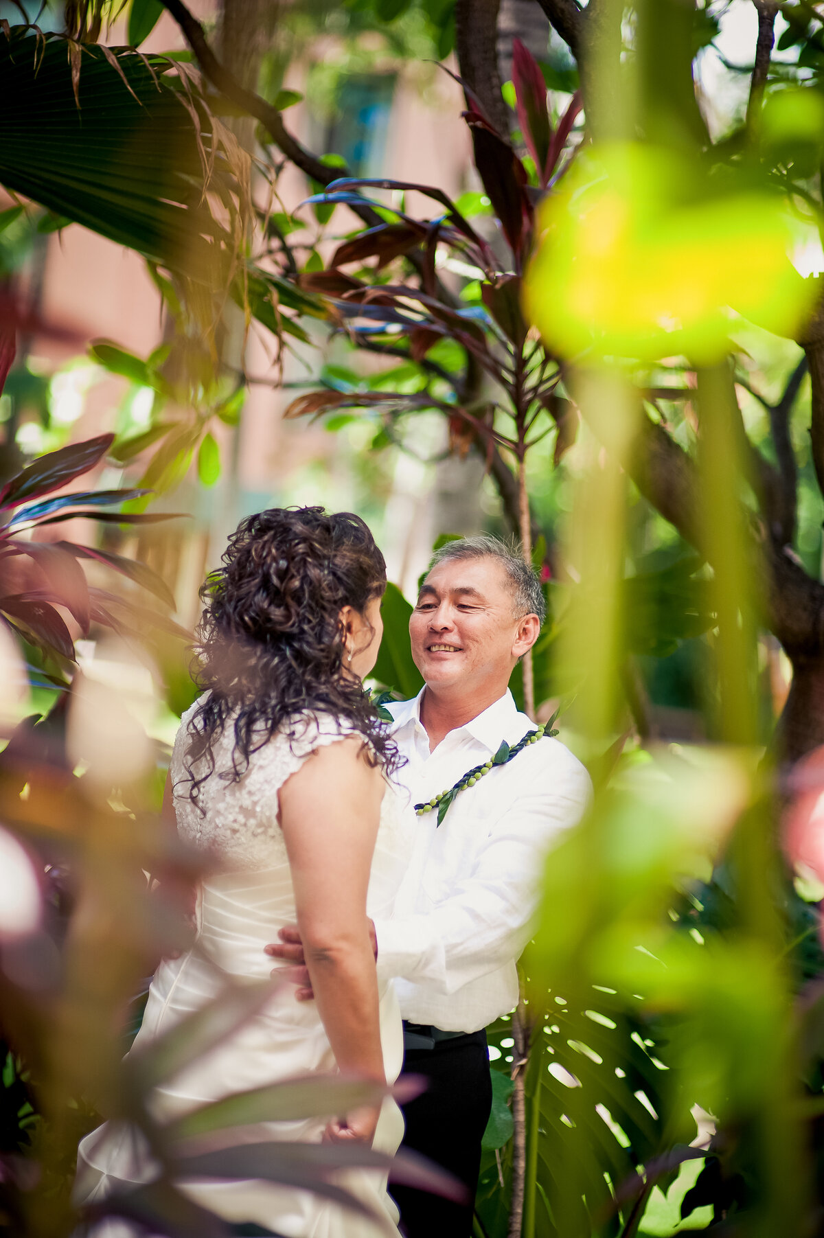 Bride and Groom Have a Candid Moment at the Royal Hawaiian Hotel