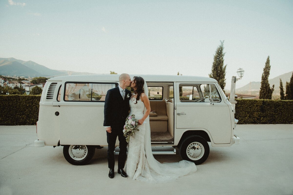 couple kissing in front of vintage van
