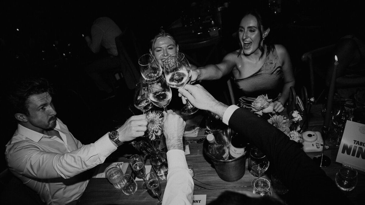 Wedding guests cheers their glasses at The Stables in Manchester.