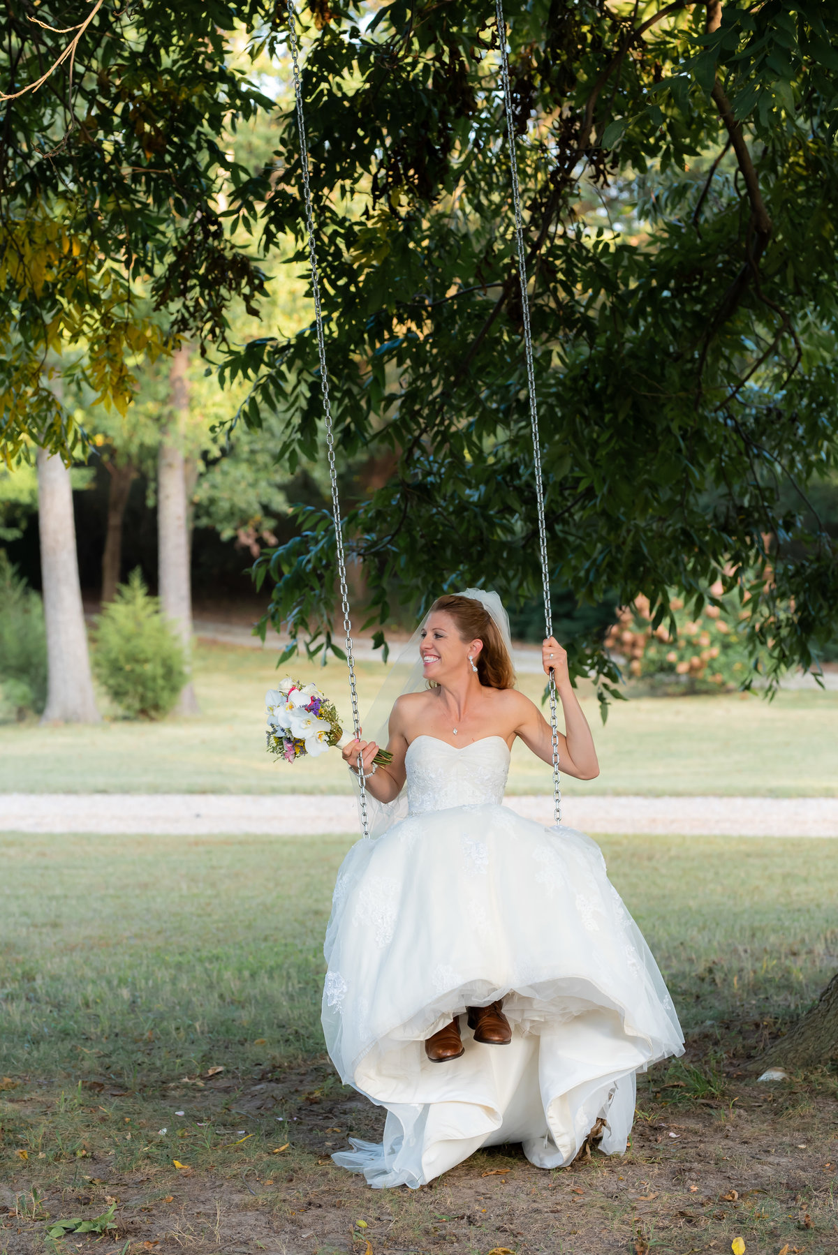 Bride on a swing. Richmond  wedding photographers.