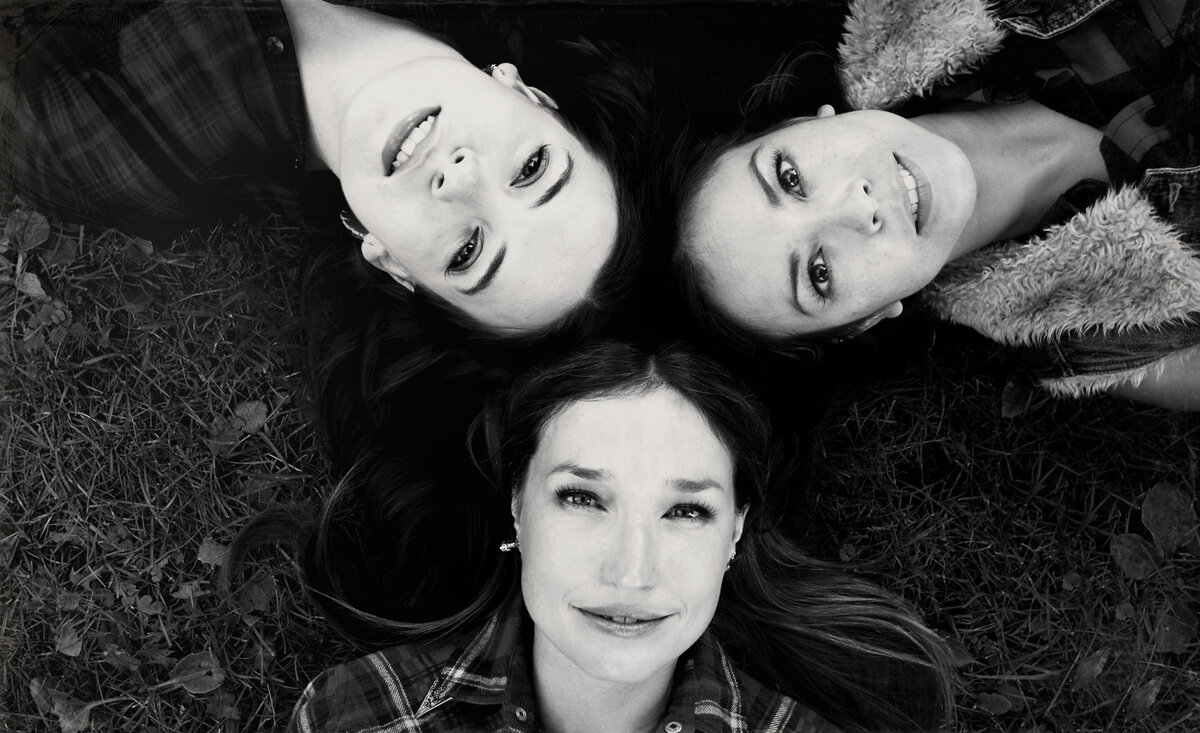 Musical trio Trent Severn black and white close up lying down looking up