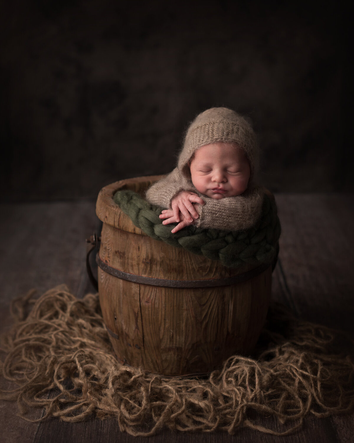 Sleeping newborn in a Bucket