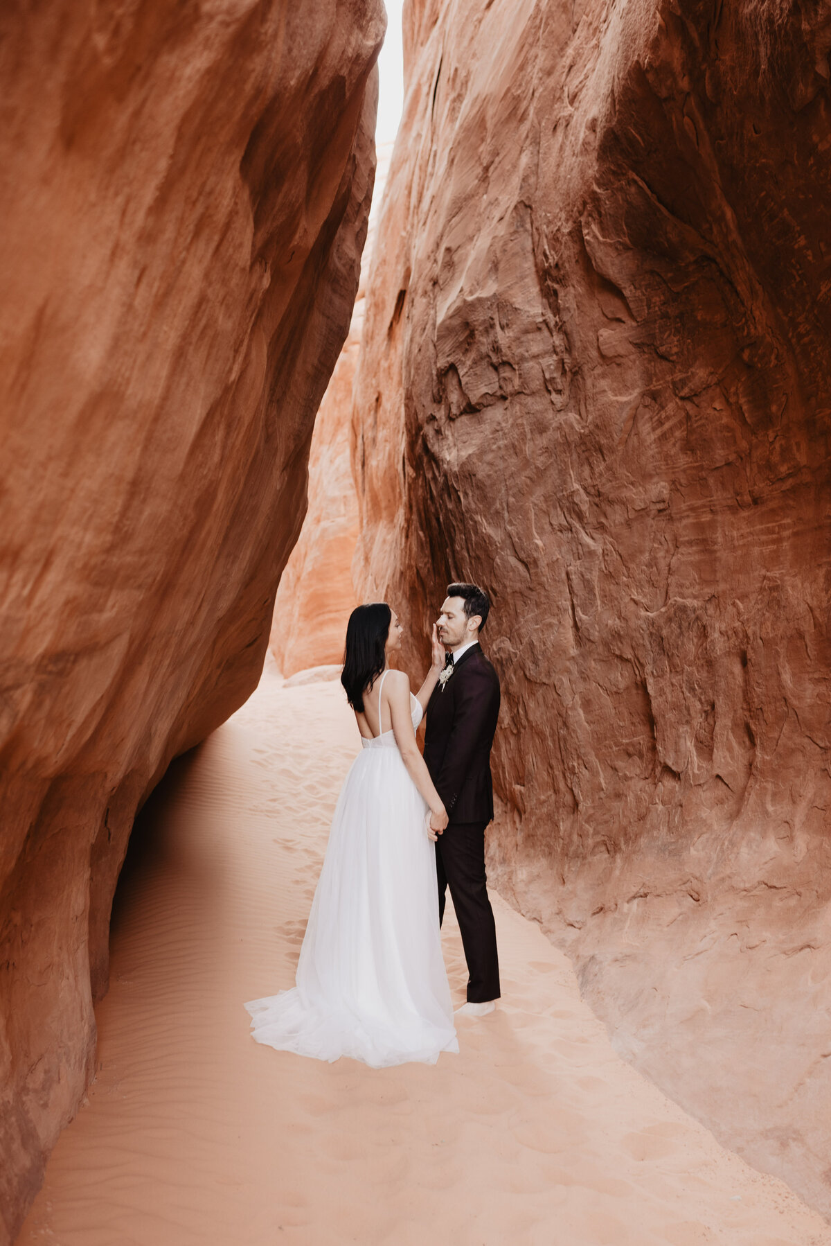Utah elopement photographer captures bride touching groom's face
