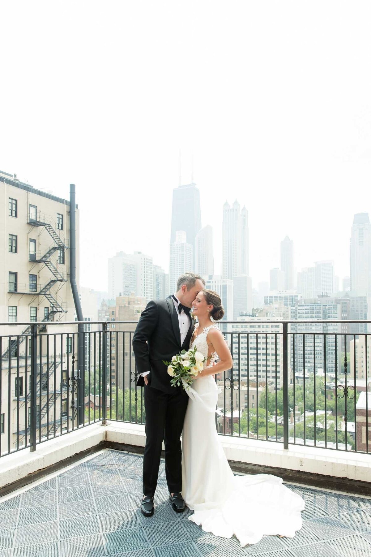 Romantic Rooftop First Look in Chicago at the Ambassador Hotel before a Luxury Chicago Outdoor Historic Wedding Venue.