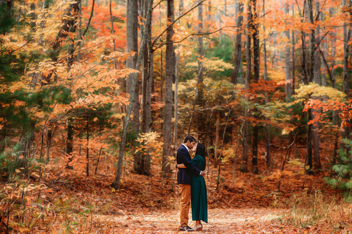 Couple embraces for photos during Family Photoshoot on the Blue Ridge Parkway in Asheville, NC.