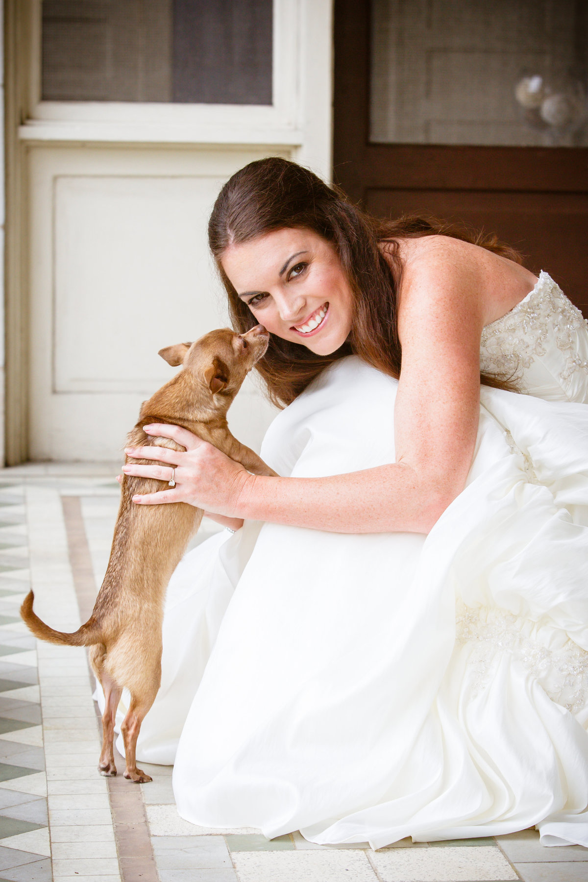 Lindsay Coulter's bridal photo with her dog Lucy before her wedding to George Zoghby in Mobile, Alabama.