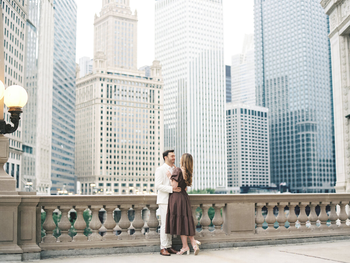 Bride and groom embracing in the city photographed by Chicago editorial wedding photographer Arielle Peters