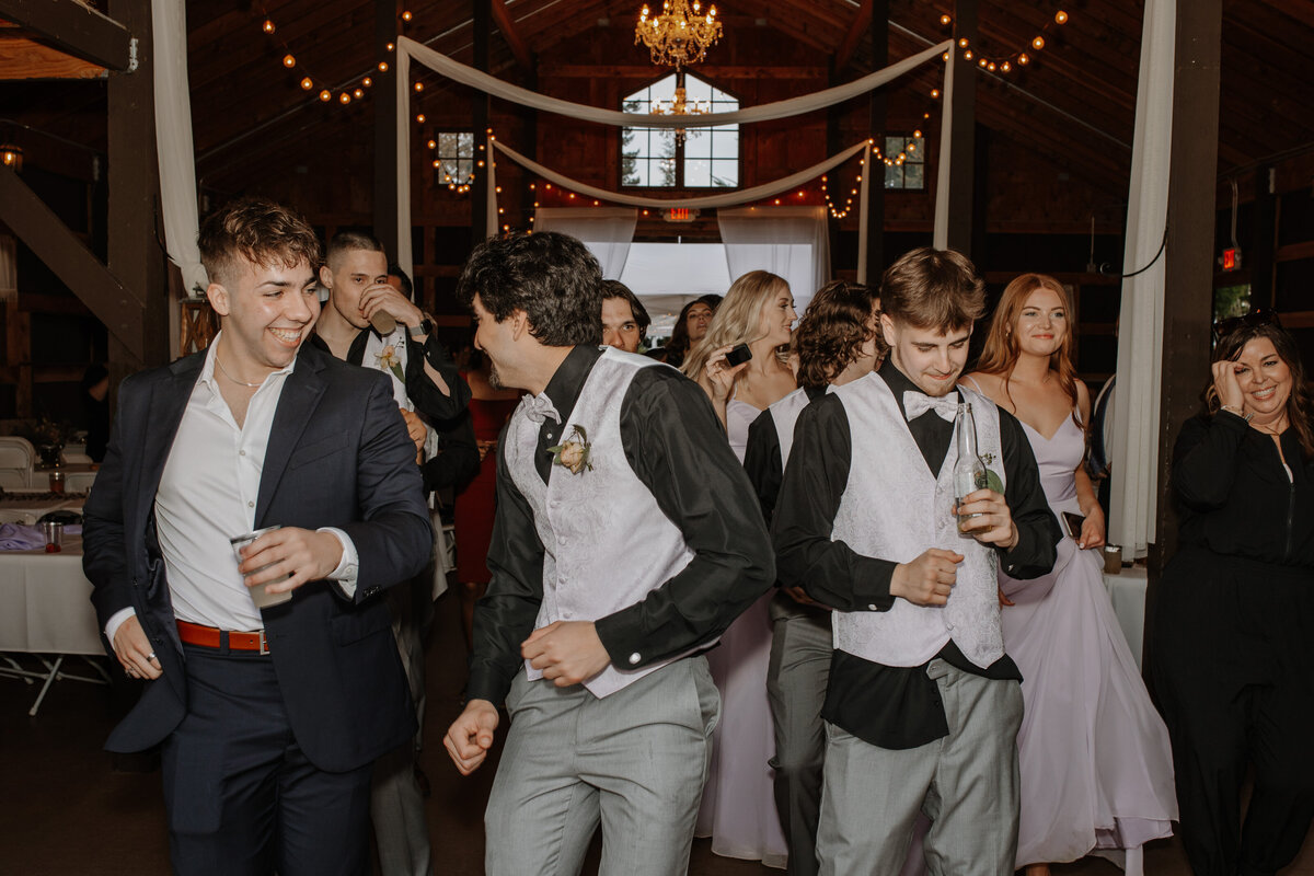 Group of young people dancing at wedding