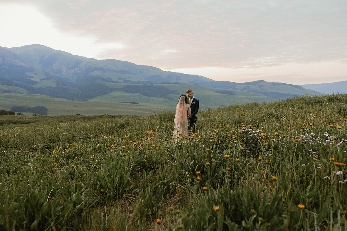 Couple have their mountain vow renewal photos taken in the heart of Mount Crested Butte trails.