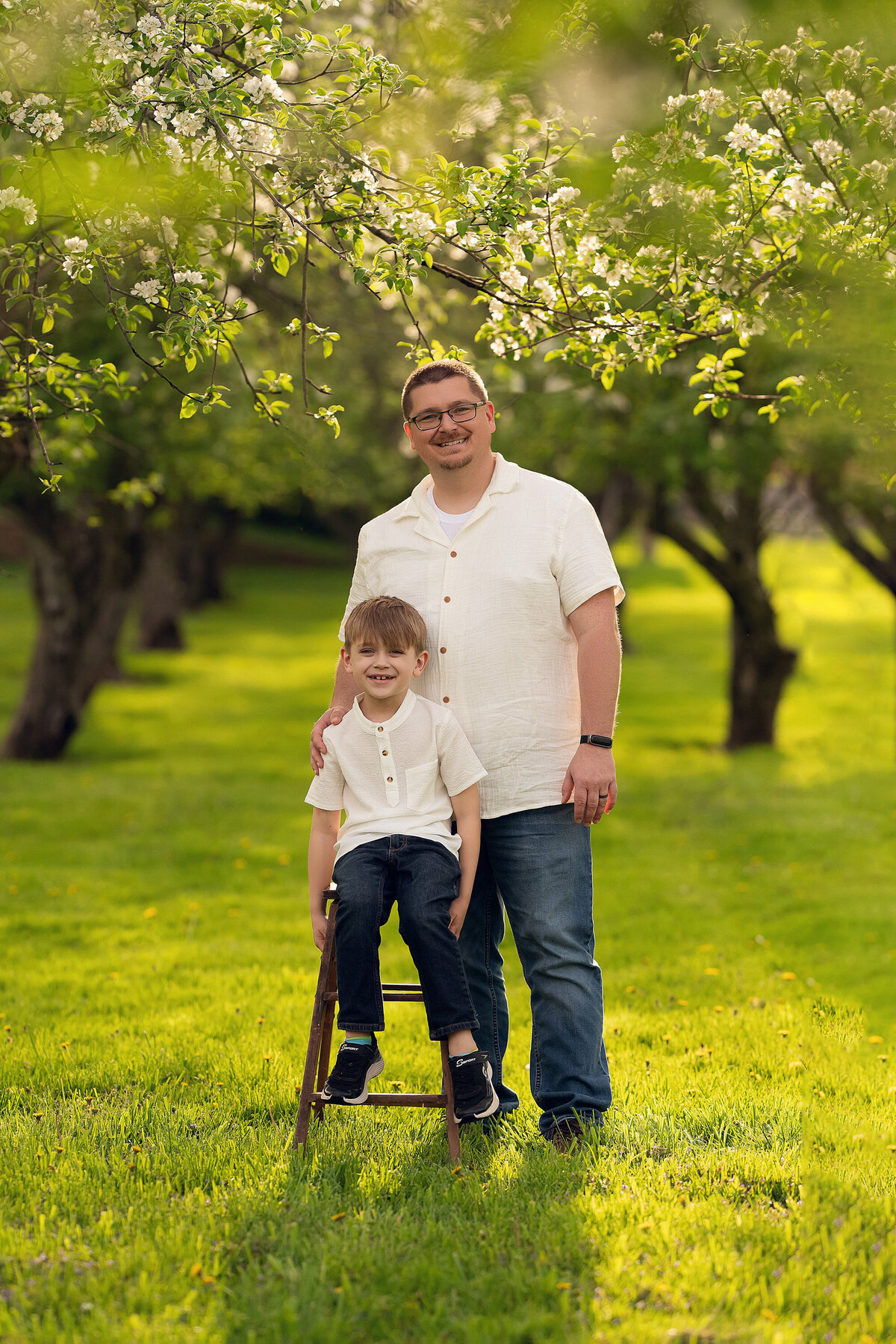 A father poses with his son in a Waukesha, WI orchard.