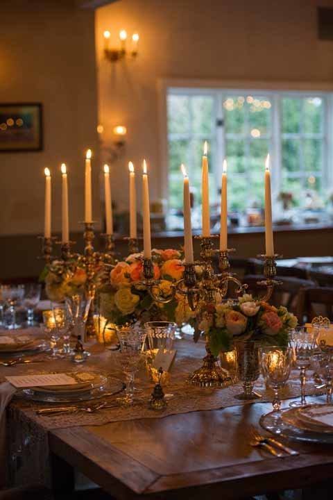 romantic candel centerpiece with compote arrangements with candelabras at Chateau Lill