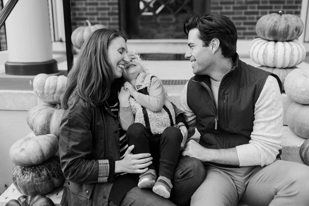 Black and white image of family laughing together