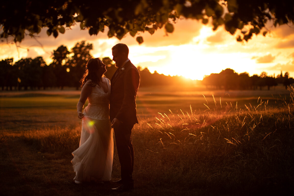 Bride and Groom Photography in field at sunset