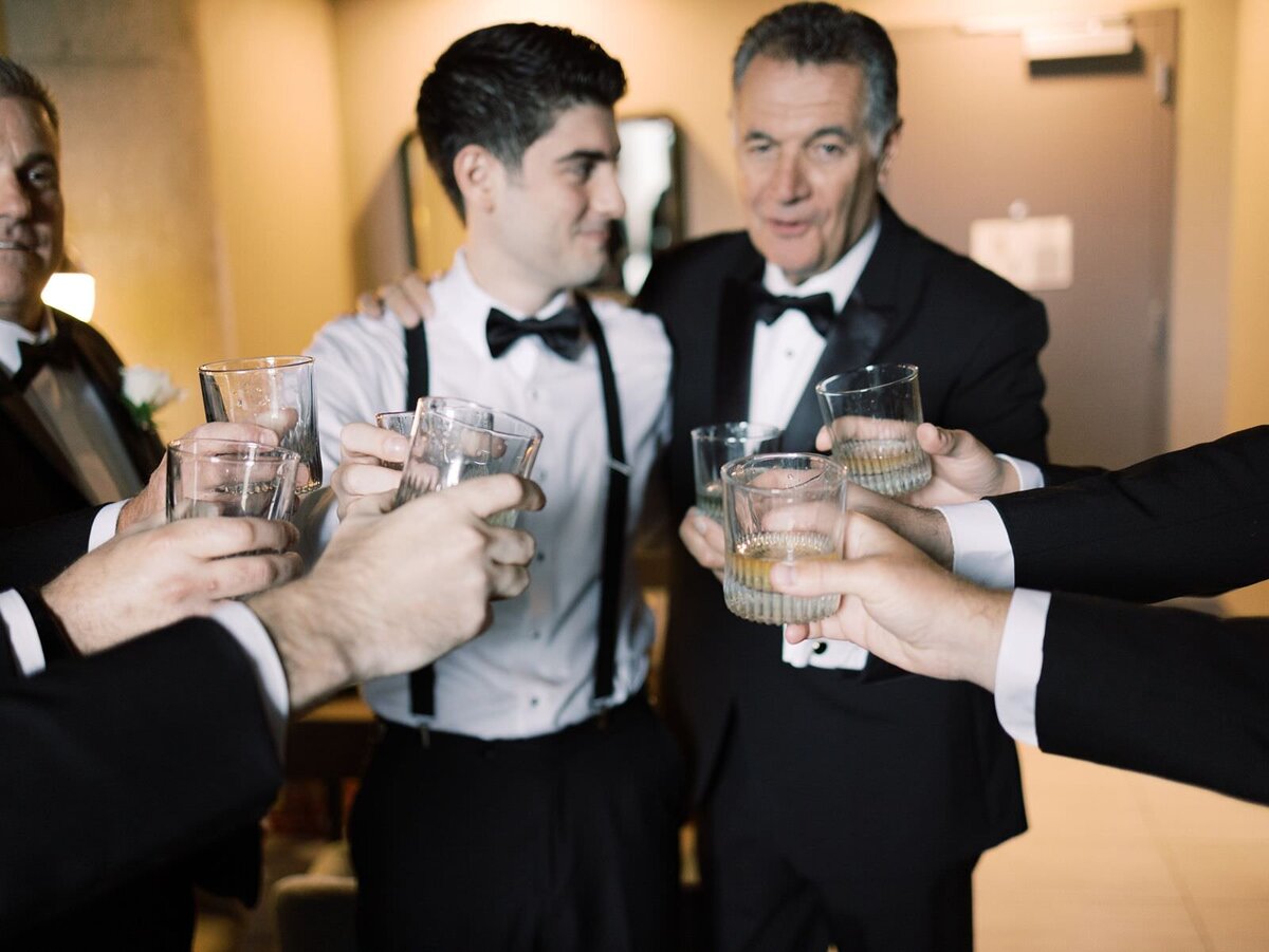 Groom-Celebrating-With-Groomsmen-at-Wedding-by-Clementine-Weddings-Chicago
