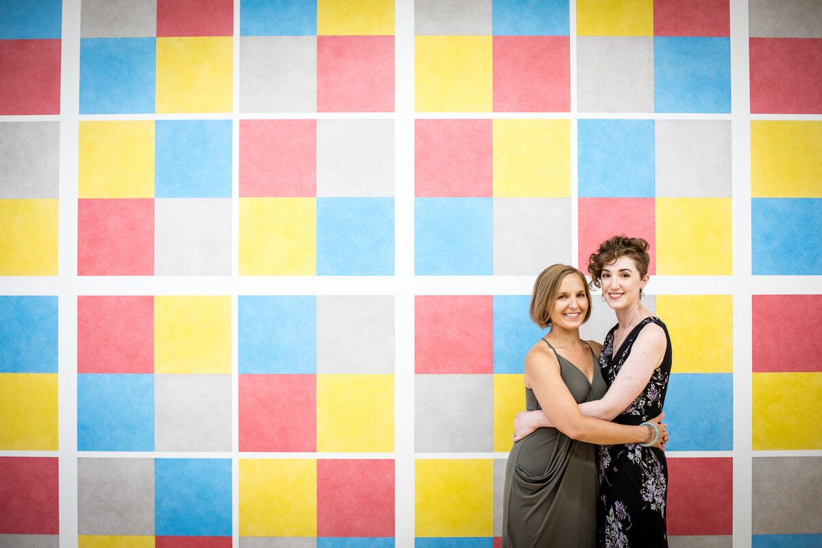 two brides pose for a wedding photo at MASS MoCA