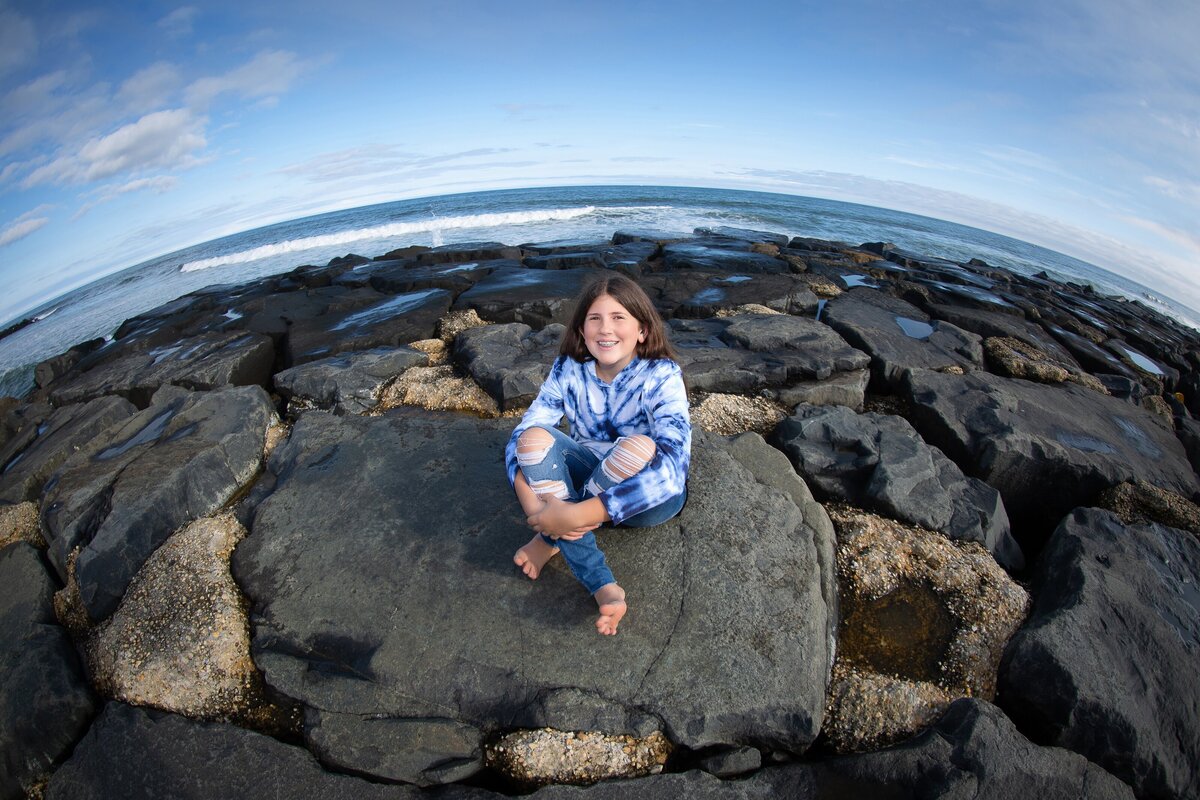 bat-mitzvah-preshoot-asbury-park-sitting-rocks-shore