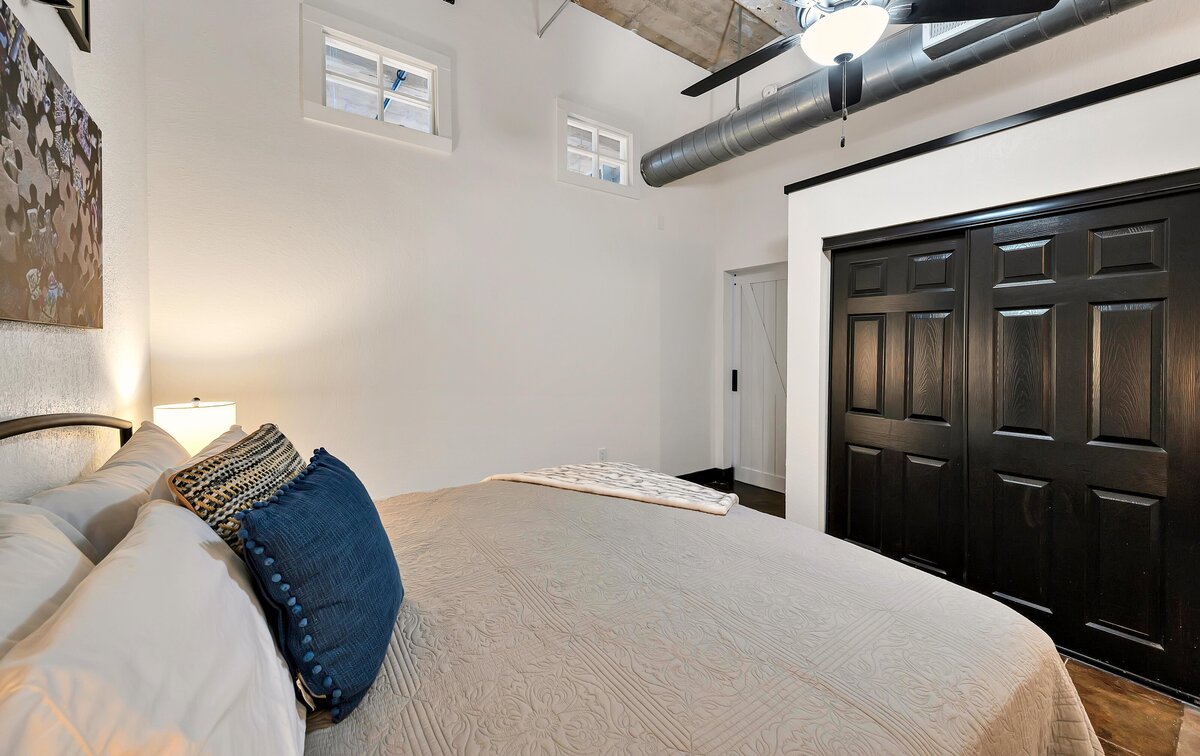 Large king size bed in this one-bedroom, one-bathroom vintage industrial condo with Smart TV, free Wi-Fi, and washer/dryer located in downtown Waco, TX.