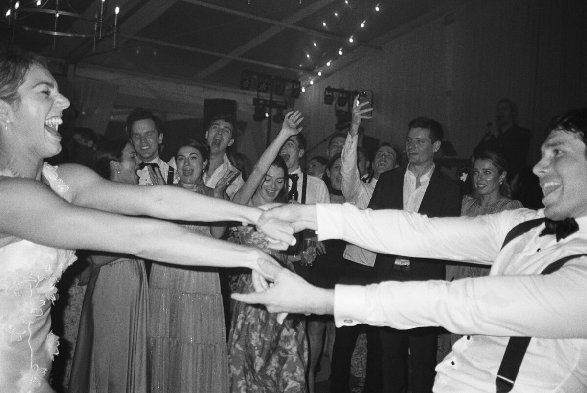 Black and white front flash film photos. Kailee DiMeglio Photography. Lowndes Grove spring wedding reception.