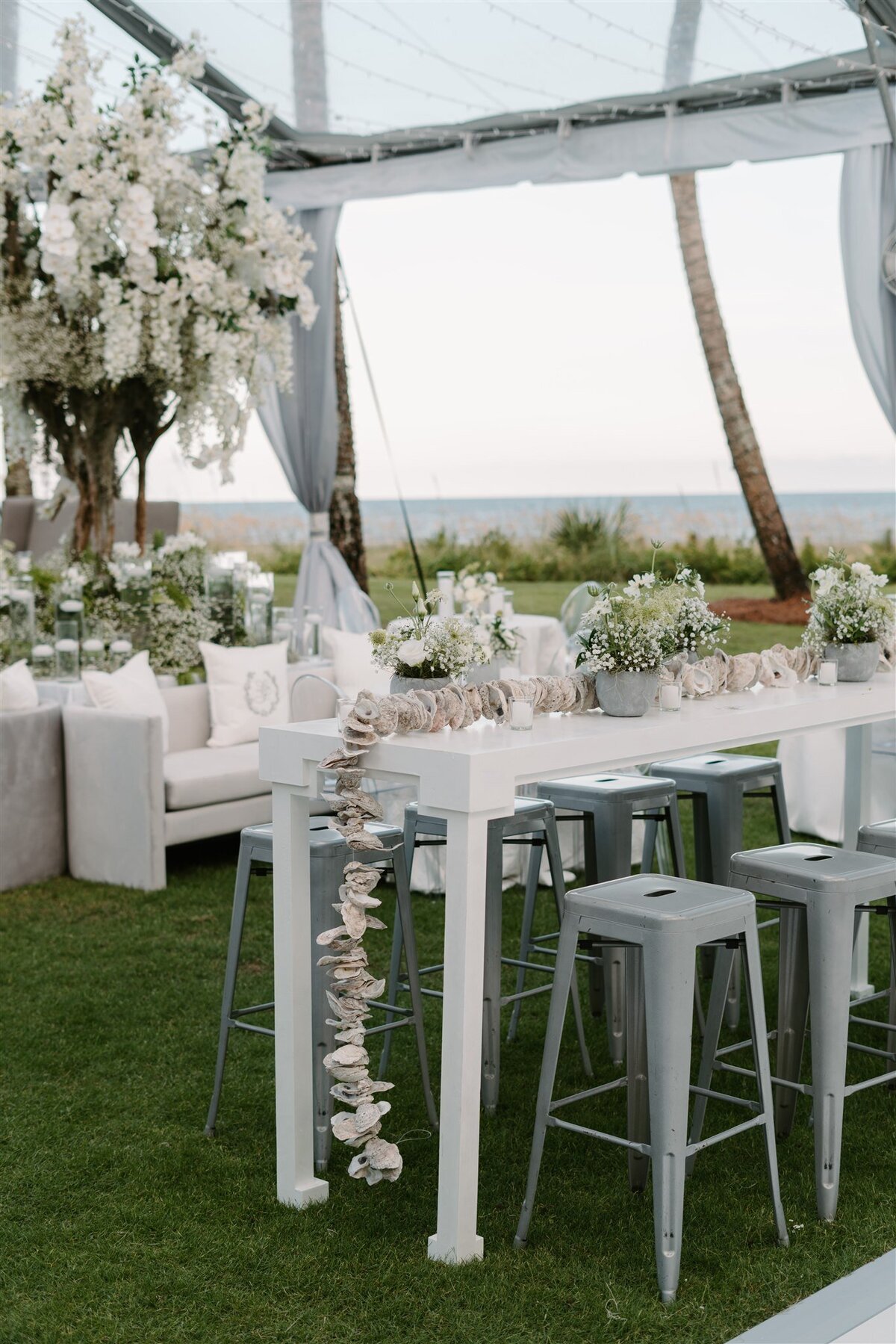 hightop cocktail tables at luxury Sea Island wedding