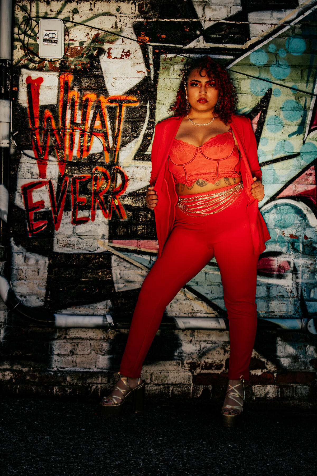 Creative portrait session in Old Town Lansing, Michigan against graffiti wall