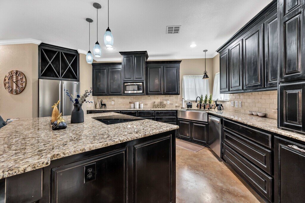 Fully stocked kitchen in this four-bedroom, four-bathroom vacation rental home and guest house with free WiFi, fully equipped kitchen, firepit and room for 10 in Waco, TX.
