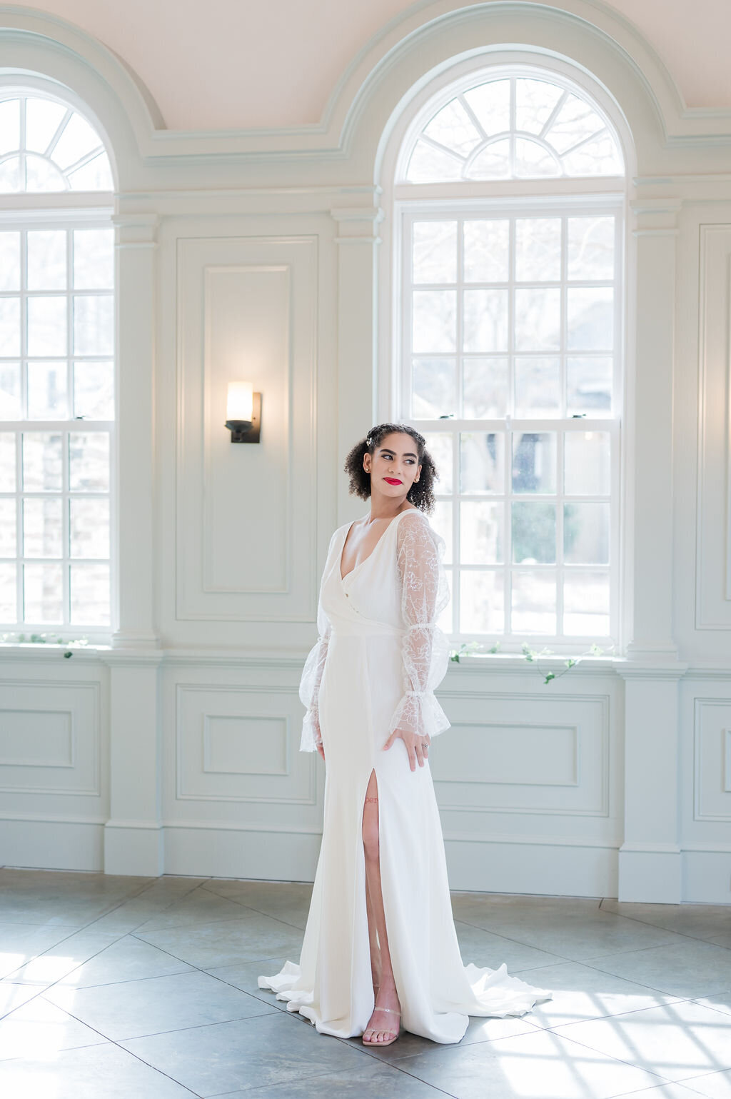 The Harlow style is a sheer long sleeve crepe wedding dress in a fit and flare silhouette by indie bridal designer Edith Elan.