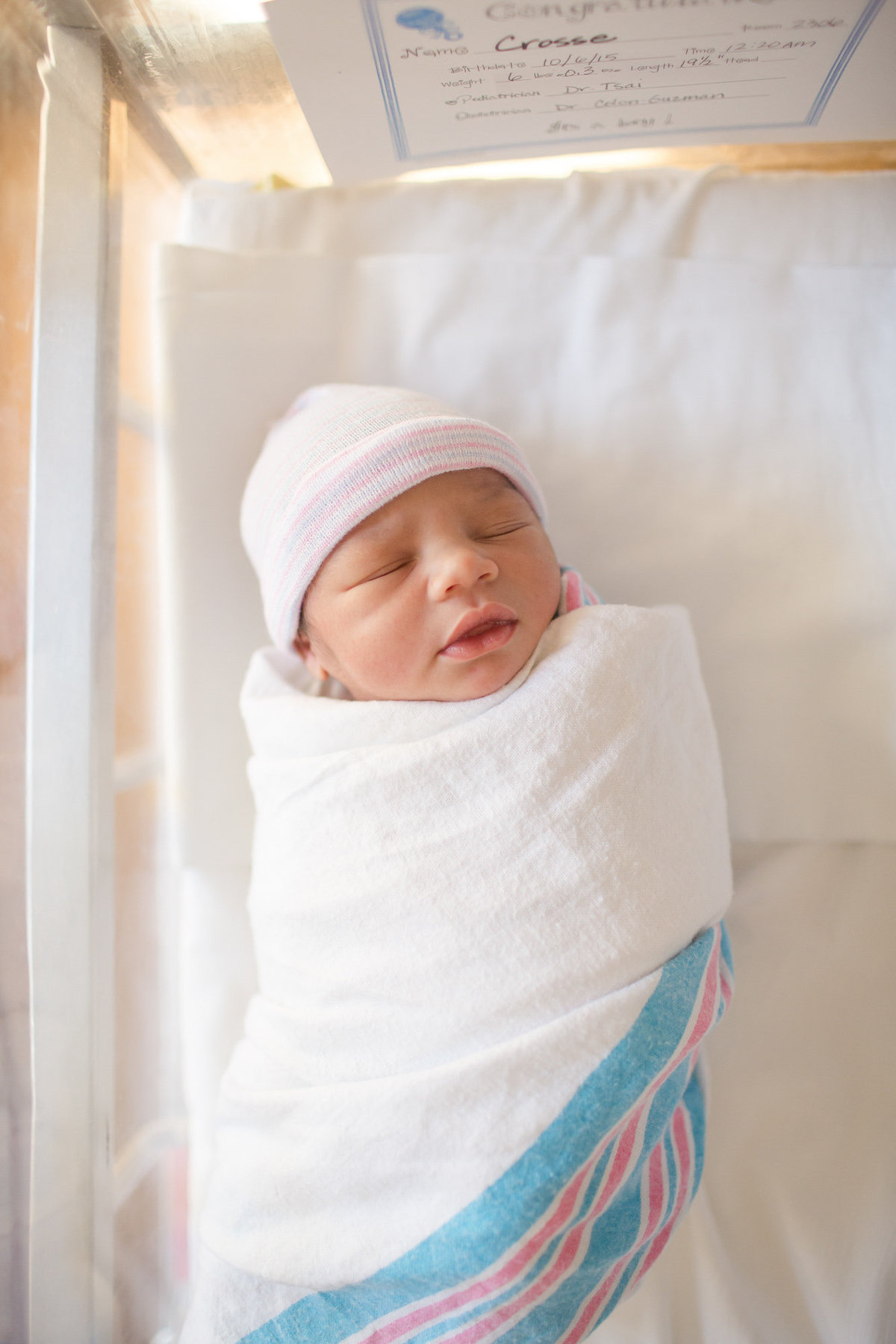 baby wrapped in hospital blanket for dc newborn photos