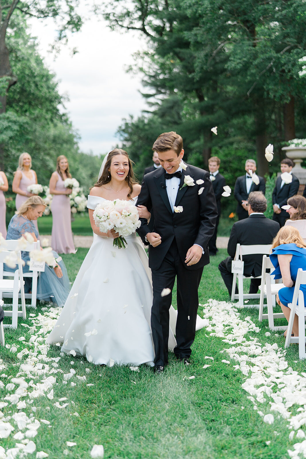 Bride and groom laugh and walk down the aisle after perfect outdoor wedding ceremony at the Bradley Estate. Boston area wedding venue. Destination wedding photographer. Kailee DiMeglio Photography.