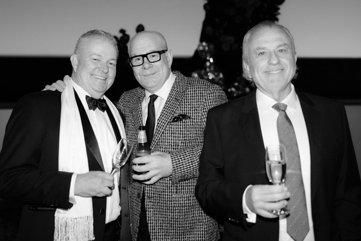 3 old men in suits holding  liquor at a Cinema wedding in Adelaide.