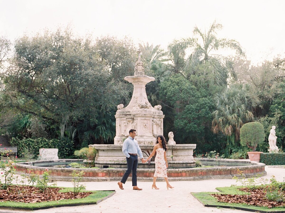 Couple-standing-in-the-gardens-at-Vizcaya-Museum-at-their-engagement-session-with-chicago-wedding-photographer-Sarah-Sunstrom-Photography