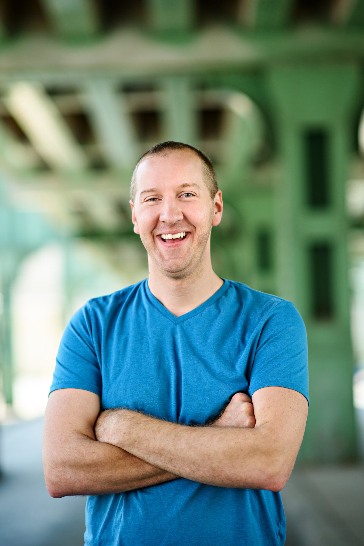 A head shot of a man smiling and looking confident.