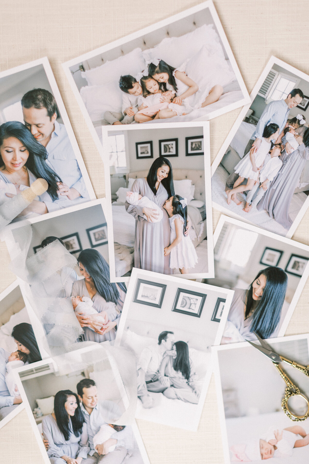Newborn photography proof prints  scattered on a table with gold antique scissors