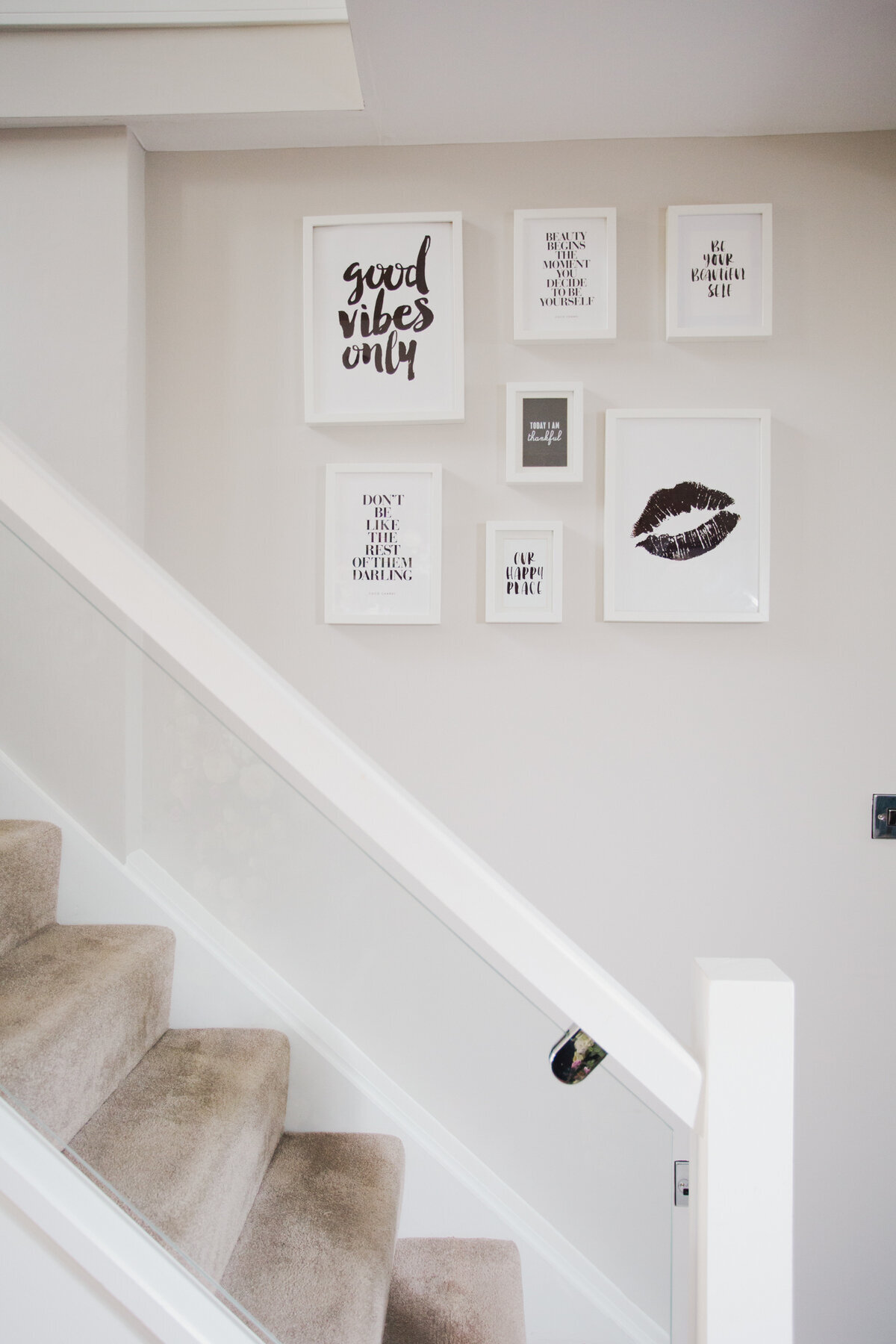 About - Staircase with wall art at Missy's Beauty Nantwich