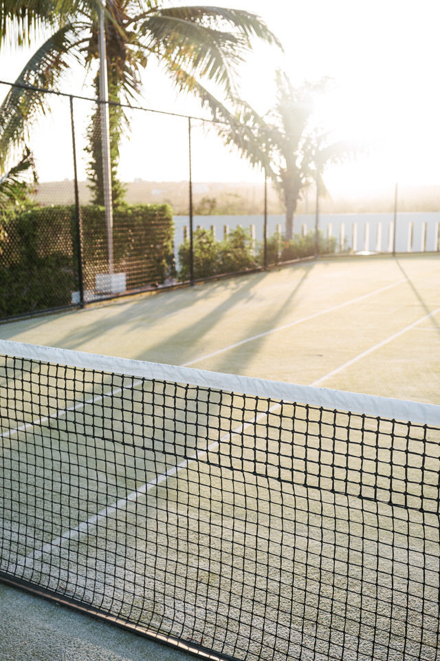 sunrise on tennis courts at ani private villa
