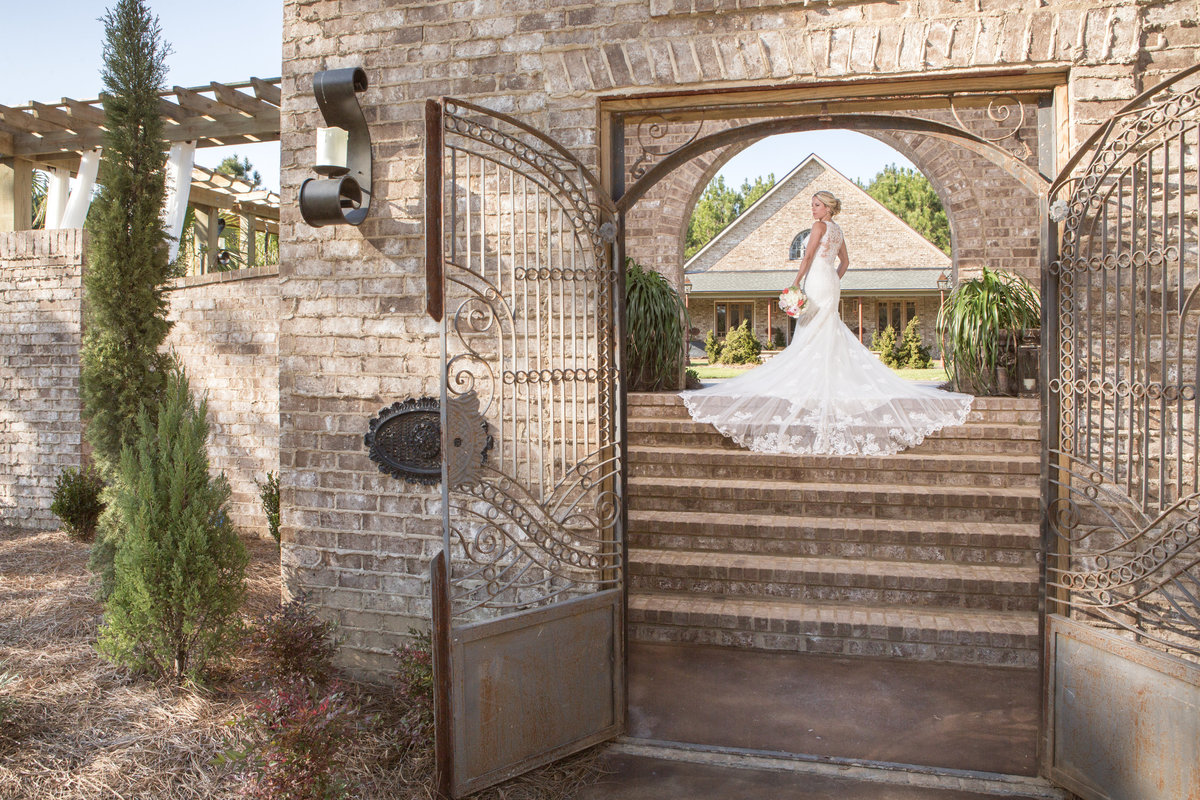 Natural light photo of bride at Bela Sera Gardens in Loxley, Alabama.