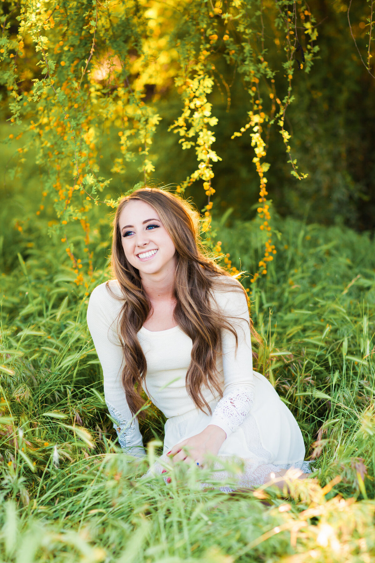 high school senior girl posing for Scottsdale senior photography session in a nature wash