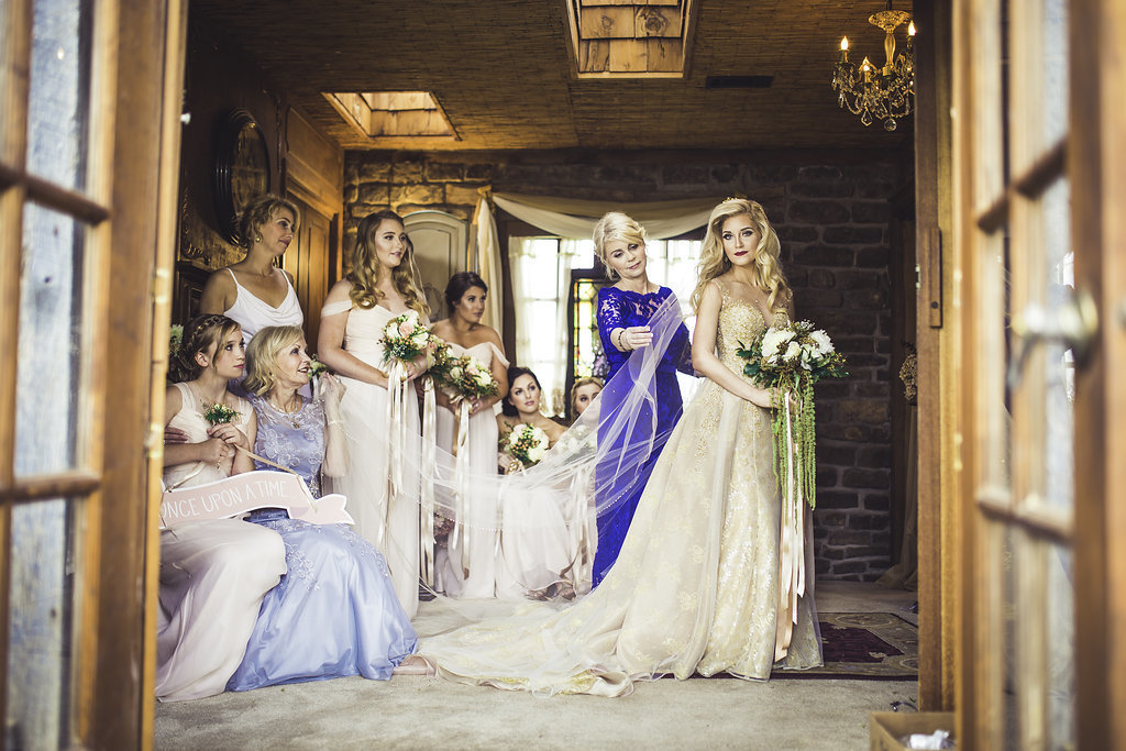 Wedding Photograph Of Bridesmaid and Bride Holding Her Bouquet Los Angeles