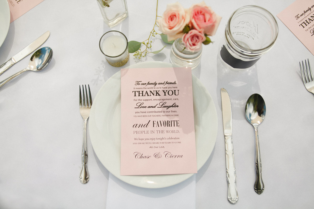 Beautiful place setting with pink menu at wedding reception | Susie Moreno Photography