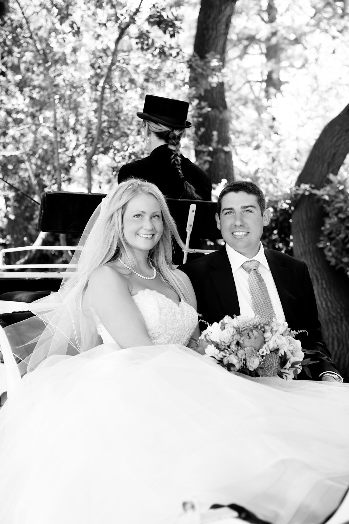Wedding photographer black and white session couple in carriage