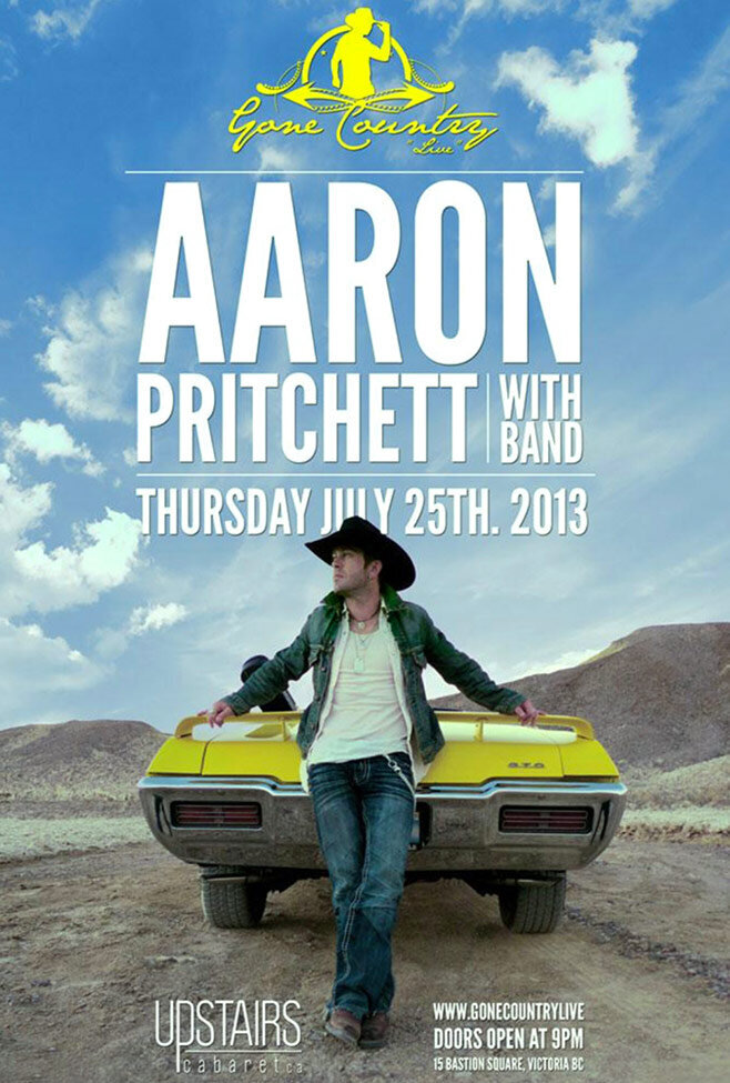 Country Music Concert promotional poster Artist Aaron Pritchett standing behind convertible yellow GTO parked on desert road wearing denim shirt blue jeans white shirt and black cowboy hat