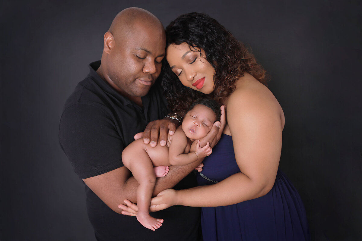 Oakville-newborn-photographer-busy-with-a-newborn-family-session