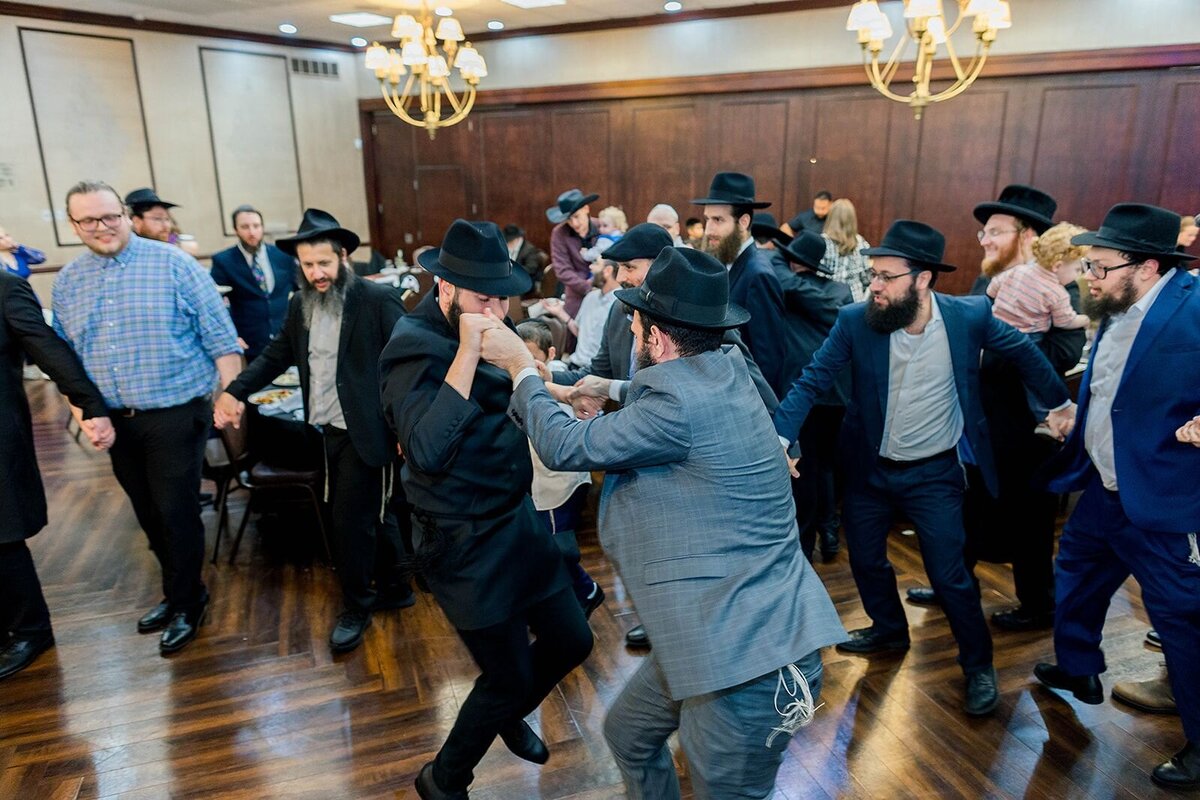 Eliana-Melmed-Photography-Chicago-LosAngeles-Jewish-WeddingPhotographer-CarmiKalman-MensDancing-00043