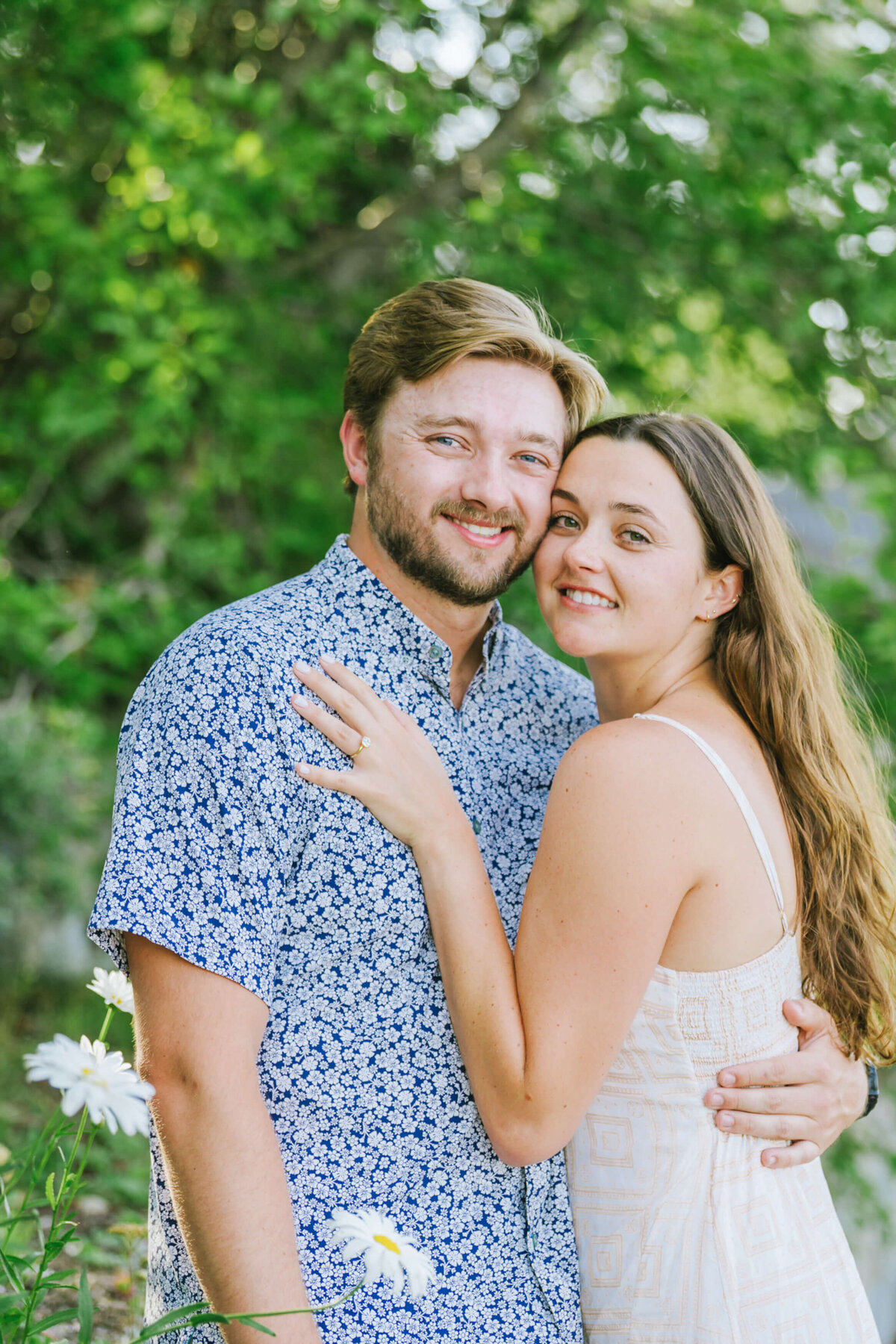 couple just engage portraits on the beach in Lake Tahoe