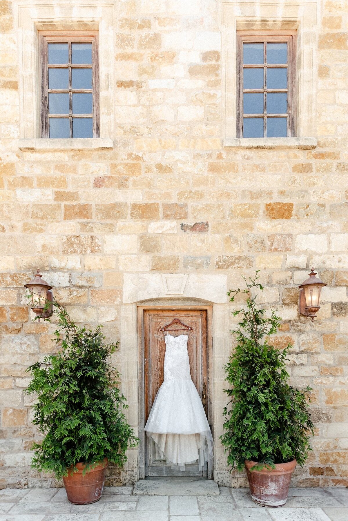 Wedding dress hanging on the door