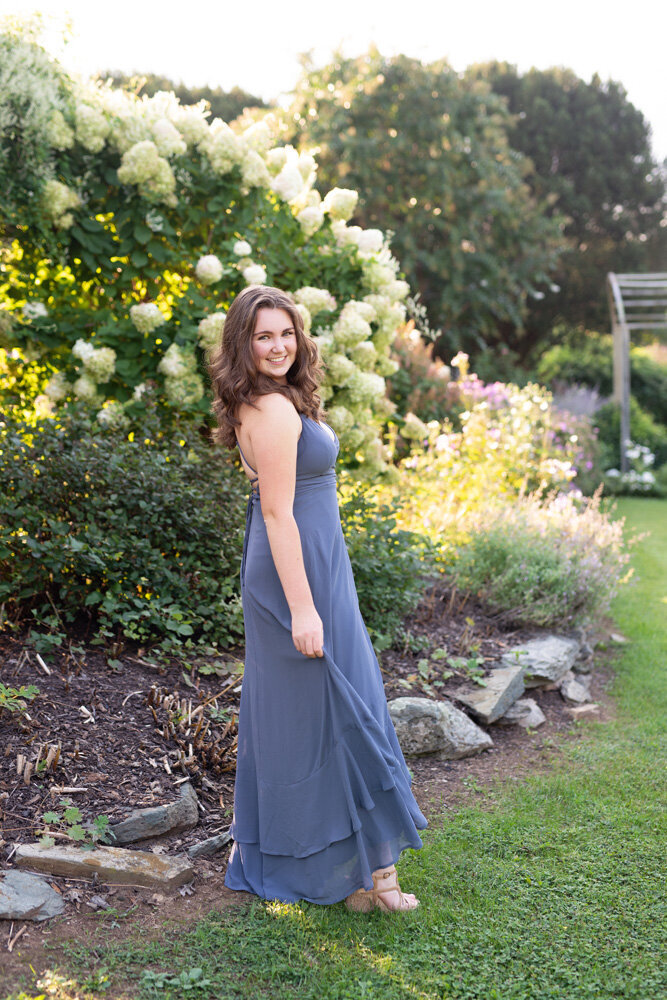 Senior session of young woman standing outside