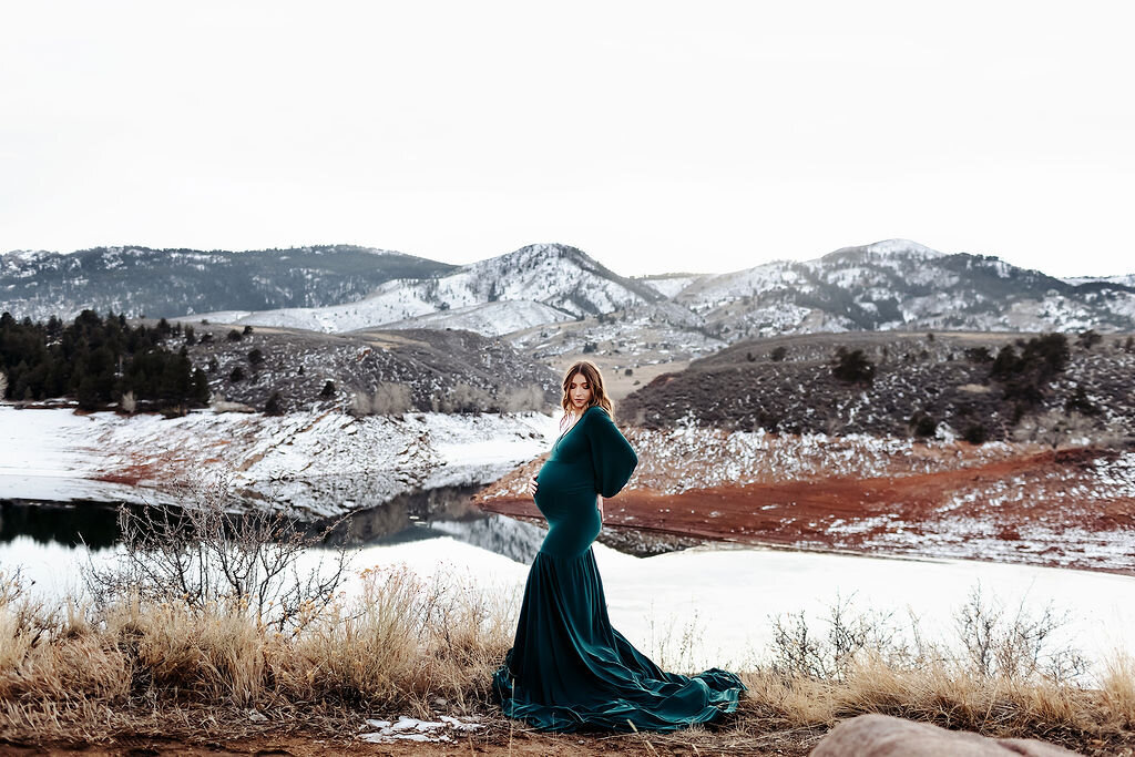 stunning mother to be in a green gown at horsetooth in denver for her maternity photos
