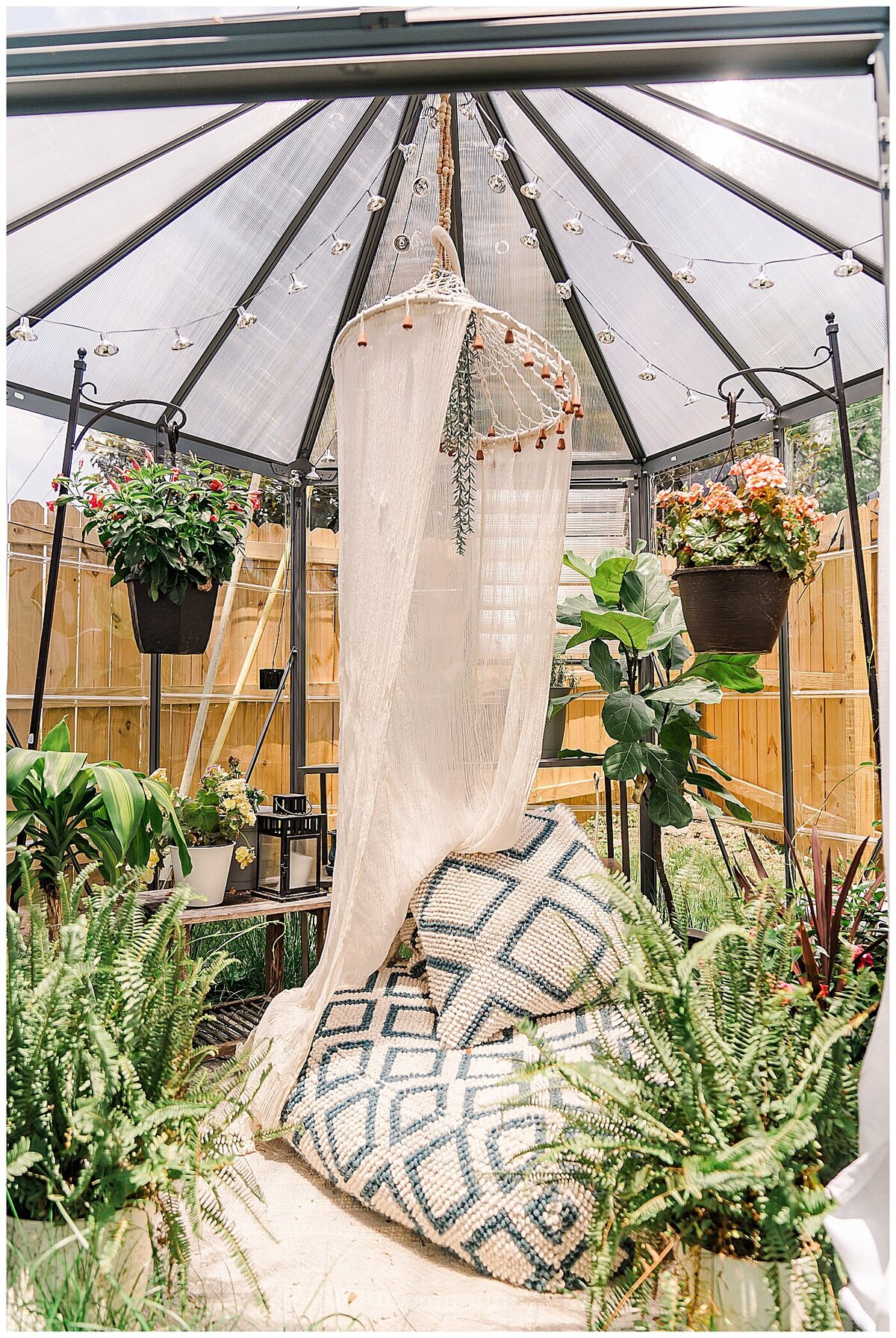 Greenhouse boudoir photography set with pillows and plants