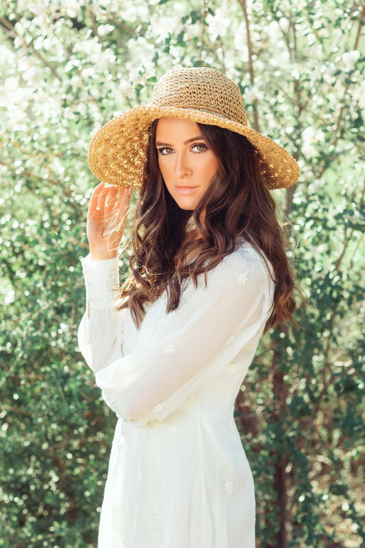 Portrait Photo Of Young Woman In White Dress And Native Hat Los Angeles