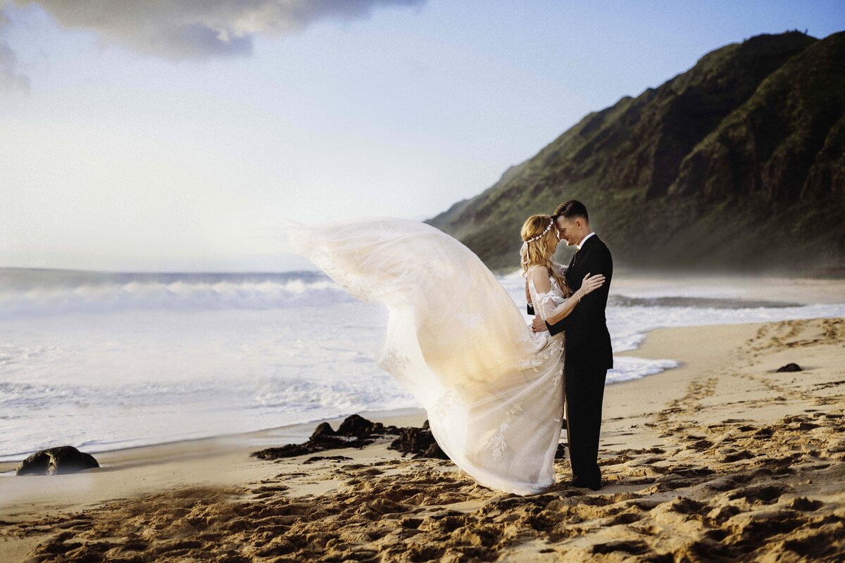 Bride and groom embracing themselves each other during a Hawaii elopement