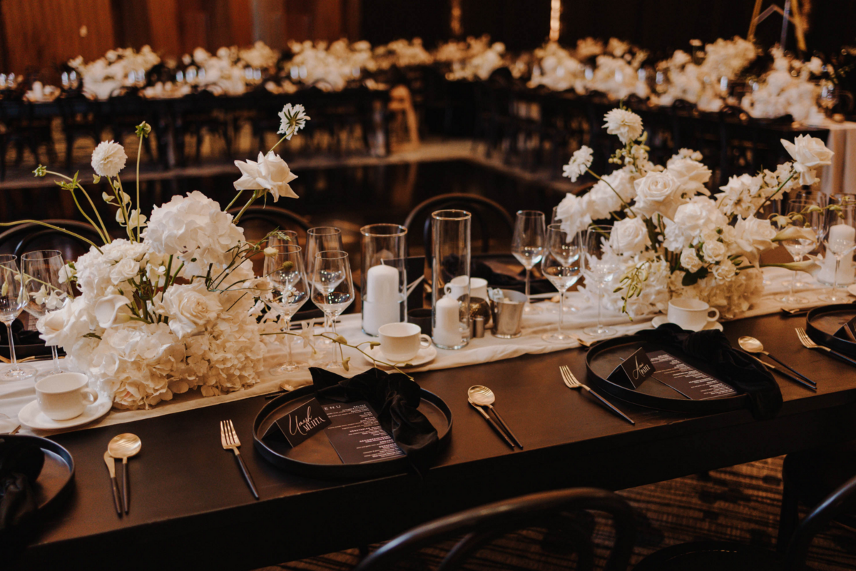 black-white-gold-wedding-reception-flowers-centerpiece-candles